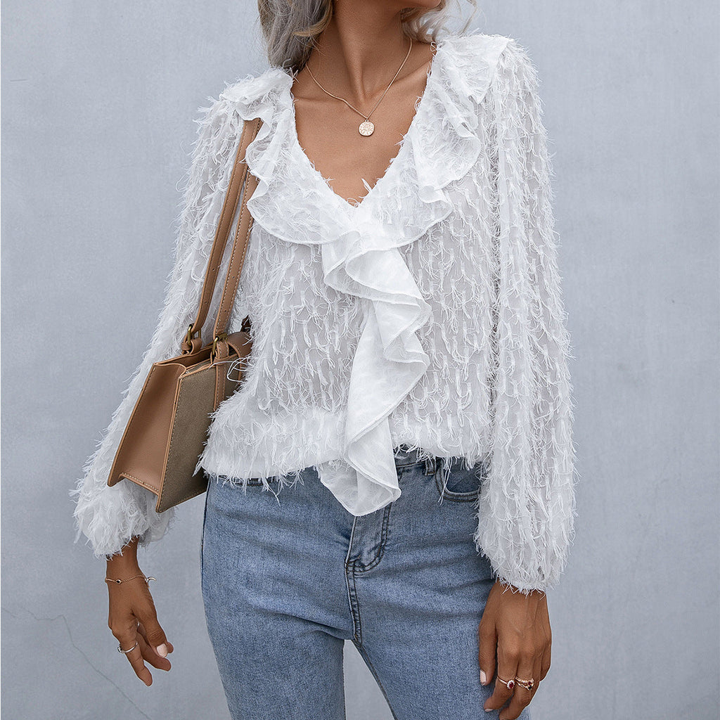 Top con volantes y plumas