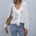 Top con volantes y plumas