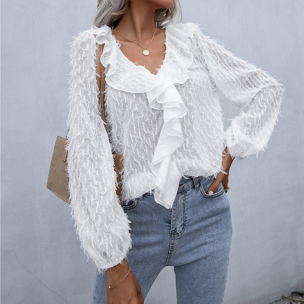 Top con volantes y plumas