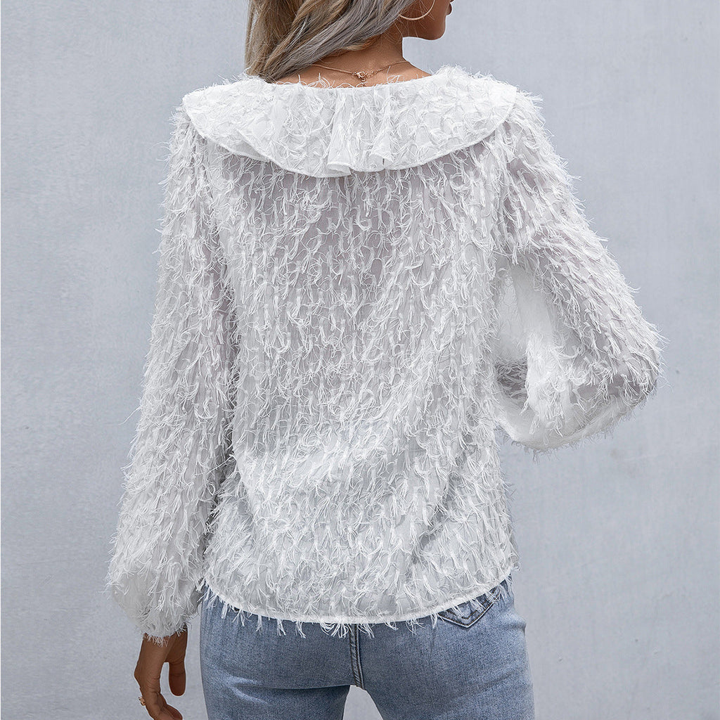 Top con volantes y plumas